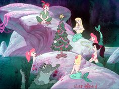 the little mermaids are sitting in front of a christmas tree and other cartoon characters