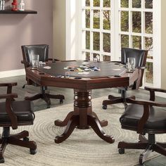 a game table with chairs around it and a rug on the floor next to it