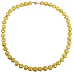 An exquisite necklace that features 10.5mm glowing golden South Sea pearls on a hand knotted silk string. Fastened with 14K yellow gold garlic clasp. A luxurious accessory perfect for any style! Hallmarks: 585 Luxury Yellow Gold Round Beaded Necklace, South Sea Pearl Necklace, String Necklace, Tahitian Pearl Necklace, Coral Beads Necklace, Golden South Sea Pearls, Stylish Necklace, Gold Pearl Necklace, Sea Pearl