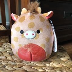 a stuffed animal is sitting on a basket