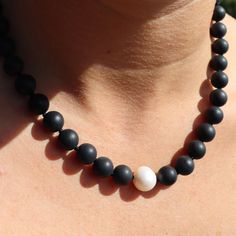 Elevate your style with our elegant Black Onyx, Pearl & Silver Fob Necklace. Crafted from matte black onyx stones, this necklace features a stunning fresh water pearl and a modern fob finish made from stainless steel with sterling silver plating. Versatile and fabulous, it's the perfect addition to any outfit. Store in a safe place to avoid scratching. Fob Necklace, Outfit Store, June Birthstone Jewelry, Black Onyx Stone, Zodiac Jewelry, Gifts For New Mums, Fresh Water Pearl, Men's Jewelry Rings, Pearl Jewellery Earrings