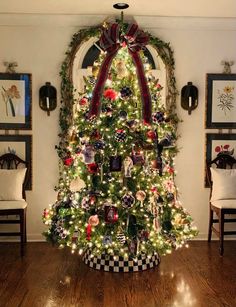 a decorated christmas tree in a living room