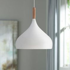 a white light hanging from a ceiling in a room