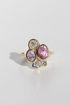 Be bold and unique with the Tidepool Ring. This customizable gemstone cluster ring is handmade with your choice of stones. Add a luxe touch to your wardrobe with an extraordinary and one-of-a-kind piece. This product page is for the setting. Once your order is placed for the setting, our team will be in touch to discuss stone selection. Once your stones are chosen, you will be sent a second invoice for the price of your gems. If you have an ideal budget in mind for the stones, we are happy to di Unique Gemstone Cluster Ring In Yellow Gold, Unique Diamond Cluster Ring With Multi-stones, Unique Cluster Multi-stone Rings, 14k Gold Cluster Ring With Accent Stones, Luxury Multi-stone Cluster Ring, Pink 14k Gold Cluster Ring With Gemstone, Heirloom Multi-stone Cluster Ring, Luxury Yellow Gold Cluster Ring, Formal Pink Gemstone Flower Ring