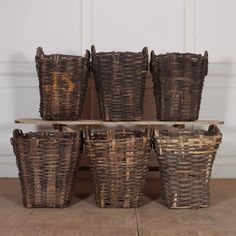 six brown wicker baskets stacked on top of each other