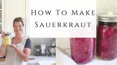 a woman holding a jar filled with food in front of a kitchen counter and the words how to make sauerkraut