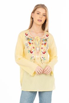 Featured on a lemon yellow background, this boho style blouse is made from 100% natural cotton voile fabric with drawstrings. It also features floral embroidery on the yoke and collar.Model is 5’8” - wearing size small. Model Bust: 34”Hand-wash cold, lay flat to dry.Made in India. Casual Embroidered Top With Boho Collar For Spring, Yellow Long Sleeve Top With Chikankari Embroidery, Bohemian Peasant Top With Embroidered Neckline For Spring, Spring Beach Peasant Style Embroidered Top, Yellow Bohemian Tops With Floral Embroidery, Bohemian Yellow Tops With Floral Embroidery, Yellow Long Sleeve Blouse With Floral Embroidery, Folk Style Peasant Top With Boho Collar For Spring, Summer Cotton Peasant Top With Tassel Ties