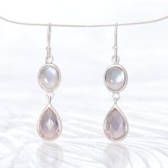 "Specifications Item Code: SE456 Metric Dimensions: 45 x 11 x 6 mm Imperial Dimensions: 1 ¾\" x ½\" x ¼\" Weight: 32.5 Carats (6.5 grams) Unique Qualities These Moonstone & Rose Quartz Earrings are a must-have accessory for any jewelry collection. Featuring the stunning combination of moonstone and rose quartz, these earrings will add a touch of elegance and sophistication to any outfit. The stones are believed to have healing properties, providing emotional balance and promoting love and harmon Gemstone Properties, Rose Quartz Earrings, Rose Quartz Gemstone, Emotional Balance, Quartz Rose, Quartz Earrings, Healing Properties, Rainbow Moonstone, Gemstone Earrings