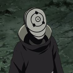 a person in a black hoodie with a white object on their head and eyes