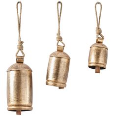 three brass bells hanging from rope on white background