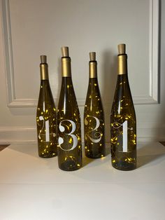 three wine bottles with the number thirteen on them