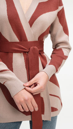 A versatile wardrobe essential for any time of day. The Elma Cardigan features a bold abstract pattern and can be worn open for a relaxed look or fastened with the detachable belt for a more tailored silhouette. Dress it up with tights for an elegant evening or pair it with trousers and jeans for an everyday look. Knit Cardigan, Wardrobe Essentials, Gift Guide, Rust