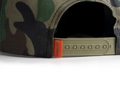 Designed with the rugged spirit of exploration in mind, this hat combines style, functionality, and durability to keep you comfortable on your overland journeys. Camo with an embroidered hunter orange patch logo with a snapback enclosure. All-Day Comfort Snapback Enclosure Protection Against the Elements One Size Fits All Outdoor Trucker Style Snapback Hat, Military Style Flat Bill Baseball Cap For Outdoor Activities, Military Style Flat Bill Baseball Cap For Outdoor, Urban Trucker Hat With Logo Patch For Outdoor, Military Style Snapback Hat With Curved Brim For Outdoor, Military Style Snapback Hat With Curved Brim, Military Style Baseball Cap Snapback, Outdoor Khaki Snapback Hat With Flat Bill, Khaki Snapback Hat For Outdoor With Flat Bill