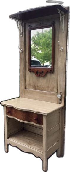 an old wooden dressing table with mirror on it's top and shelf below the mirror