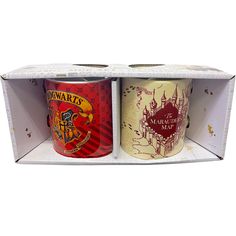 two harry potter coffee mugs are in a cardboard storage unit, one is red and the other is yellow