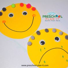 two yellow paper plates with faces painted on them