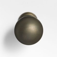 an antique brass door knob on a white background