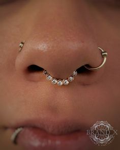 a close up view of a nose piercing