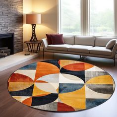 a living room with a couch and a rug on the floor in front of a fire place