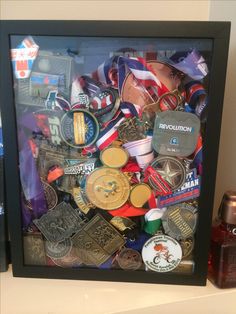 there are many medals in the shadow box