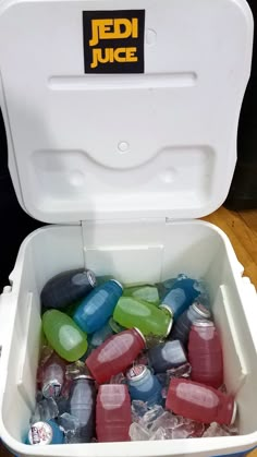 a cooler filled with lots of different colored drinks