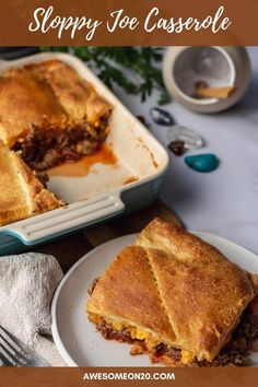 there is a casserole with meat and cheese on the plate next to it