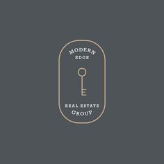 the modern edge real estate group logo on a dark background with a gold key in the middle