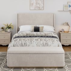 a bedroom with a bed, two nightstands and a rug