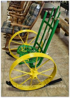 two green and yellow chairs sitting next to each other on top of a tile floor