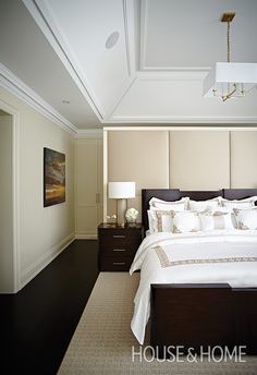 a bedroom with a large bed and two nightstands