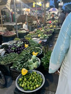 an outdoor market with lots of fresh produce