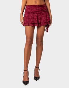 This Lace Mini Skirt Gives The Perfect Twist On A Closet Staple. With Its Delicate Lace Fabric And Ruffled Hem, It's A Versatile Piece That Adds A Touch Of Femininity To Any Outfit. Mini Skirt. Gathered Ruffle Hem. Lace Fabric. 95% Polyester, 5% Spandex. Model Wears Size S. Model Height Is 5'9. Item Care: Wash With Similar Color. | Edikted Ruby Ruffle Lace Mini Skirt Mexican Mini Skirts, Micro Skirts, Outfit Mini Skirt, Lace Mini Skirt, Burgundy Lace, Maxi Styles, Swimwear Dress, Metallic Dress, Puff Sleeve Top