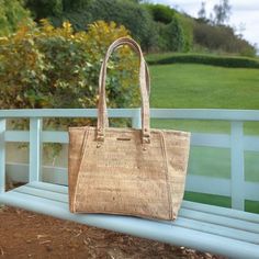 Dare to be different and step up your eco-friendly fashion game with this gorgeous cork handbag! This stunning, 13" wide, 9 1/2" tall, and 3" deep purse is the perfect accessory for both style and sustainability. With a durable natural cork exterior and handmade quality, it also boasts three spacious compartments and an interior zipper pocket. Keep everything safe and organized with zipper compartment and magnetic snap closure. Don't miss out on owning this chic and earth-conscious cork masterpi Eco-friendly Pouch Shoulder Bag For Shopping, Eco-friendly Shoulder Bag For On-the-go, Eco-friendly Handheld Satchel For Daily Use, Eco-friendly Pouch Shoulder Bag For On-the-go, Casual Satchel For Gift, Casual Satchel For Gifts, Eco-friendly Large Capacity Bag For On-the-go, Eco-friendly Handheld Shoulder Bag For Everyday, Eco-friendly Handheld Bags For Everyday Use