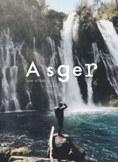 a man standing on top of a rock next to a waterfall with the words asger above it