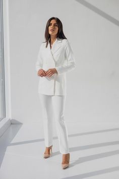 "Feel his mood by wearing a white formal suit for women - be unbridled, free and charming everywhere and always. A jacket with a slightly fitted silhouette and a stand-up collar with lapels works in your favor to feel confident and feminine. Straight wide trousers with arrows and a high rise complete the look. An elegant evening suit with a top will create uniqueness for a bride at a wedding, prom, or white party. The accent in the image with a fashionable suit is made on pants, realized with an Suits For Women White, Wedding Suits For Women, Stussy Wallpaper, Formal Suits For Women, Expensive Suits, White Wedding Suit, Women Suits Wedding, Evening Suit, Pant Suits For Women