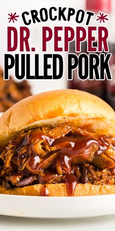 the crockpot dr pepper pulled pork sandwich on a white plate with bbq sauce