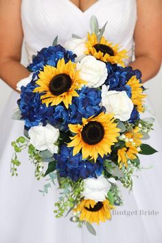 a bride holding a bouquet of sunflowers and blue flowers