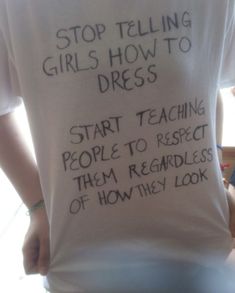 a person wearing a t - shirt with writing on it that says stop telling girls how to dress