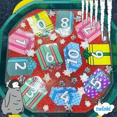 a green tray filled with lots of different types of numbers and gifts on top of it