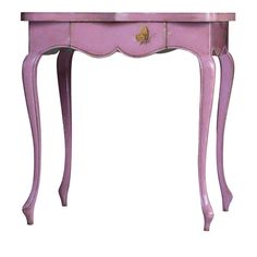 an old pink table with drawers on it