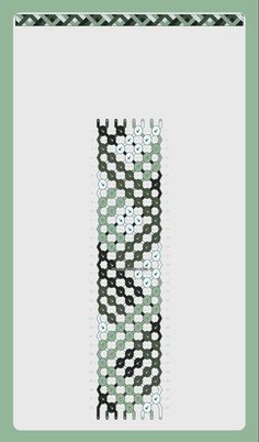 a cross stitch pattern in black and white on a green background with the letter e