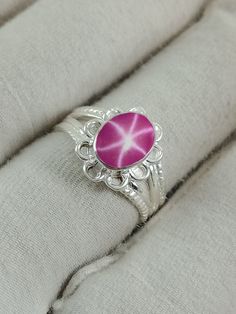 This Ring Features a 8X10 MM Oval Cabochon Natural Pink Lindy Star and Sterling Silver Finished with rhodium. Customization is available. It is made by hand, and it will take about 3 to 5 business days to finish the ring after your payment is completed. Product Description Main stone: Natural Pink Lindy Star Metal type: 92.5 Sterling Silver finished with rhodium How To take care of This Ring - Keep the jewelry away from direct heat, water, perfumes, deodorants, and other strong chemicals. Wipe t Silver Star-shaped Gemstone Ring, Silver Star-shaped Ring With Gemstone, Ring For Wife, Ring Ruby, Pink Star, Women Pink, Star Ruby, Star Jewelry, Star Ring