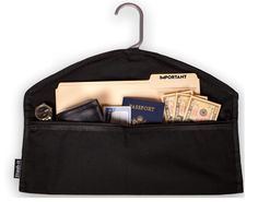 a black bag with some money in it and an umbrella hook hanging from the side