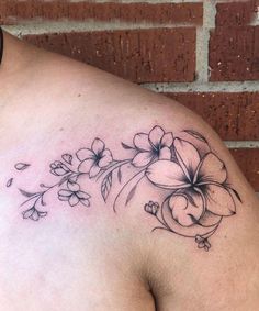 a woman's chest with flowers on it