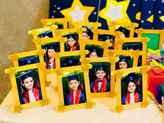 a table topped with pictures of people in graduation caps and gowns on top of it