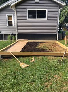 a house with a garden bed in the front yard