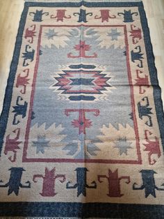 an old rug is laying on the floor