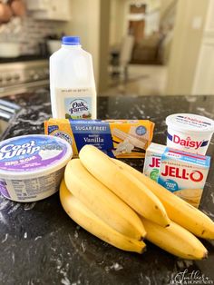 bananas, yogurt, and other ingredients on a counter