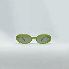 Add a pop of color to your outfit with our Apple Green Slim Oval Frame Sunglasses. The vibrant apple green frame brings a fresh and energetic vibe to your look. With their slim oval shape, these sunglasses offer a contemporary and fashion-forward appeal. Lens: Polarised lenses Frame: Slim oval shape Arms: Slim arms Nose Bridge Fit: Built in universal nose pads Case included. Bridge Width: 17 MM Arm Length: 145 MM Frame Width: 146 MM Lens Height: 37 MM Green Sunglasses With Uva Protection For Spring, Retro Green Plastic Sunglasses, Green Sunglasses With Uv Protection, Trendy Green Sunglasses With Uva Protection, Casual Green Sunglasses With Uva Protection, Casual Green Plastic Sunglasses, Green Mirrored Sunglasses In Plastic, Green Frame, Oval Sunglasses