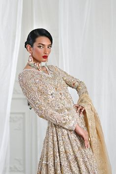 Gold Wedding Dress With Dabka Work, Bollywood Style Floor-length Hand Embellished Wedding Dress, Gold Wedding Dress For Eid Reception, Glamorous Wedding Dress With Zari Work, Festive Hand Embellished Floor-length Wedding Dress, Anarkali Hand Embellished Gown For Wedding, Glamorous Wedding Gown For Eid, Festive Glamorous Lehenga With Dabka Work, Floor-length Hand Embellished Anarkali Set For Wedding